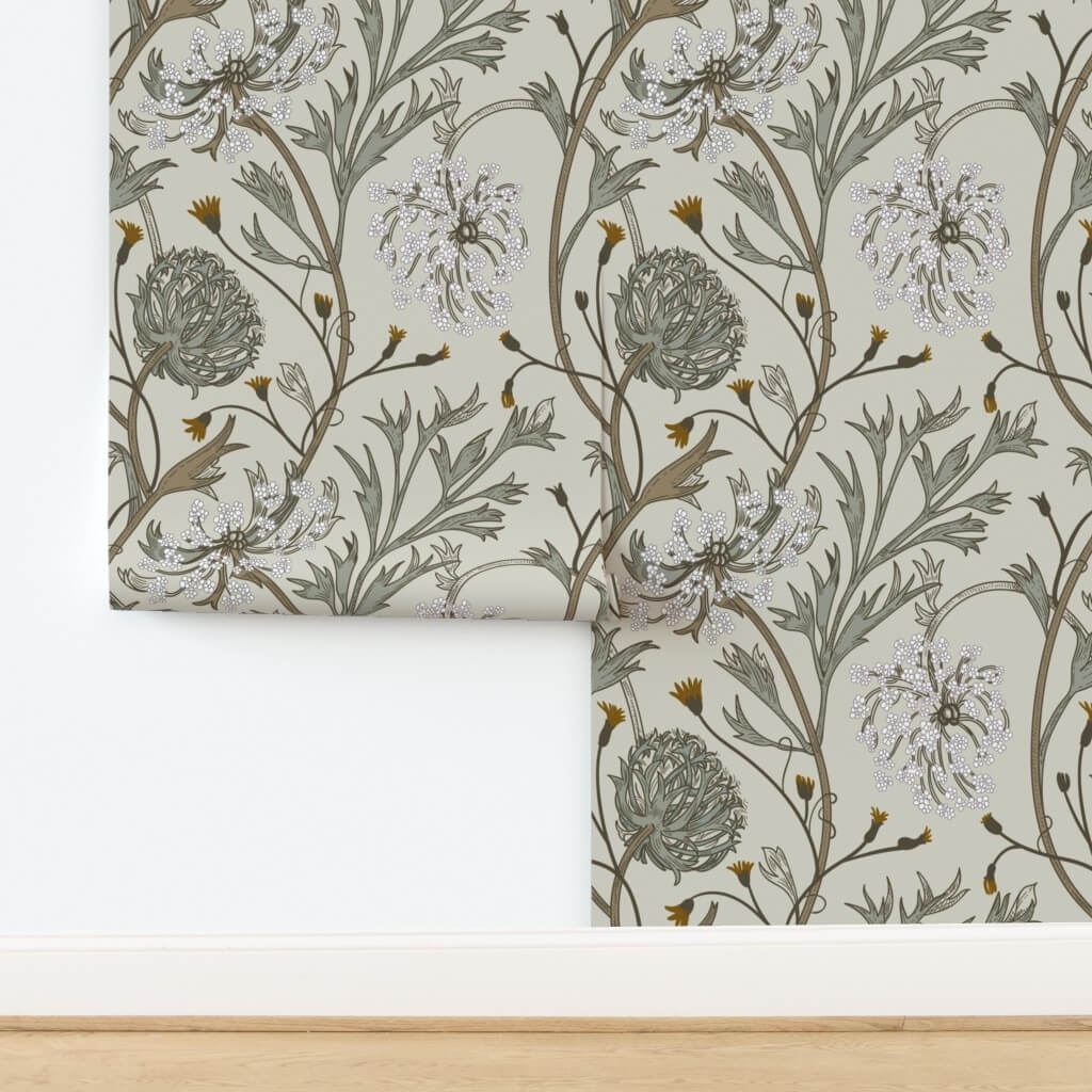 A hand gently wiping a beautiful patterned wallpaper